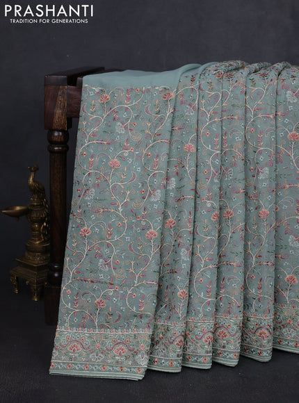 Georgette saree pastel green with allover embroidery work and embroidery border