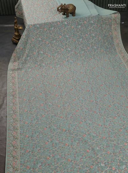 Georgette saree pastel green with allover embroidery work and embroidery border