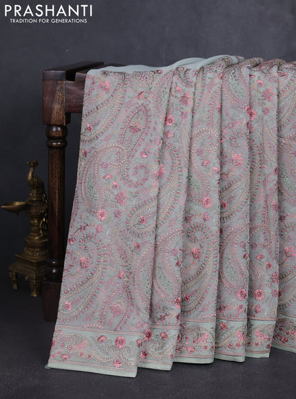 Georgette saree pastel green with allover paisley embroidery stone work