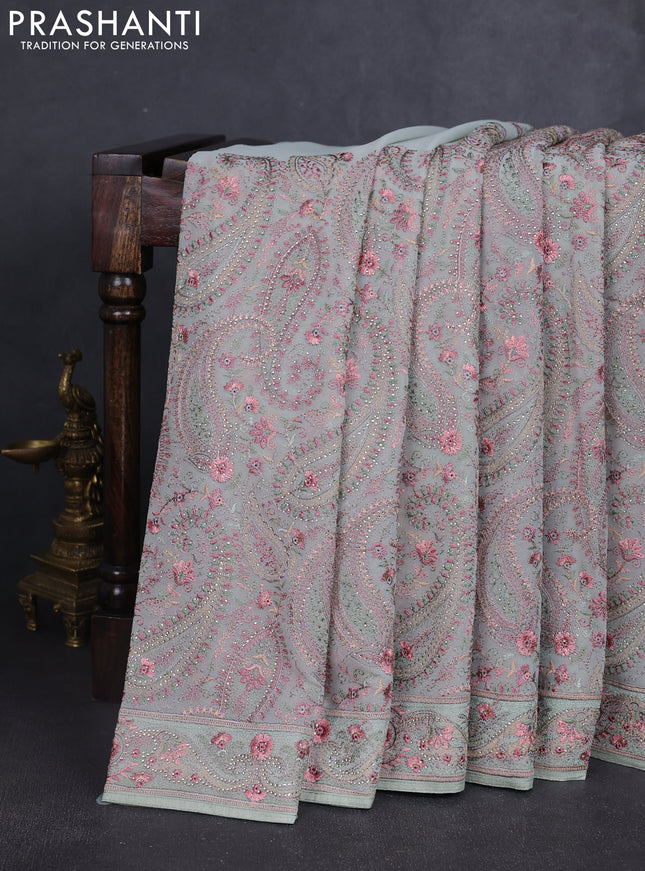 Georgette saree pastel green with allover paisley embroidery stone work