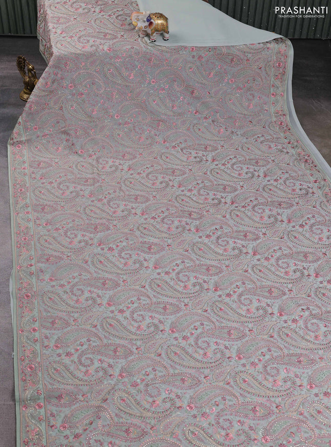 Georgette saree pastel green with allover paisley embroidery stone work