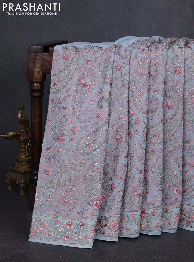 Georgette saree pastel blue with allover paisley embroidery stone work