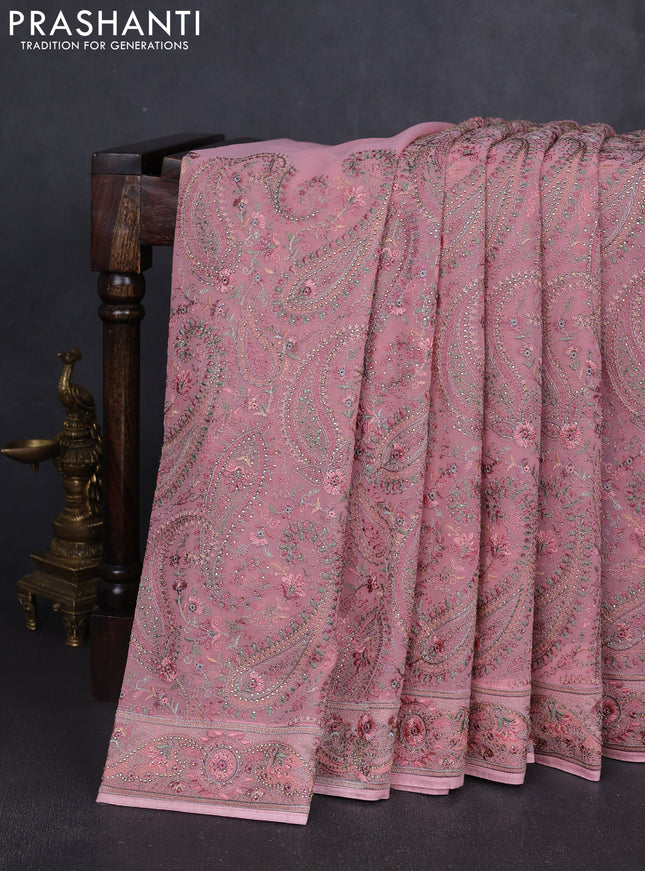 Georgette saree peach pink with allover paisley embroidery stone work