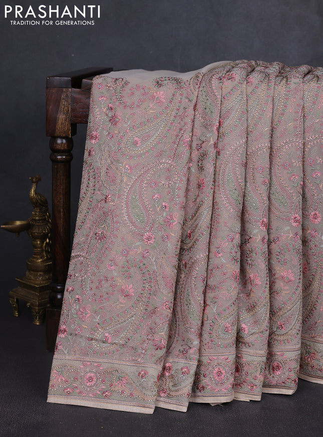 Georgette saree beige with allover paisley embroidery stone work
