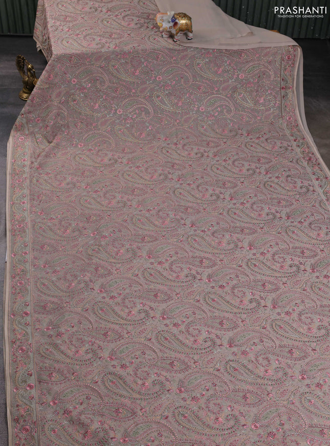 Georgette saree beige with allover paisley embroidery stone work