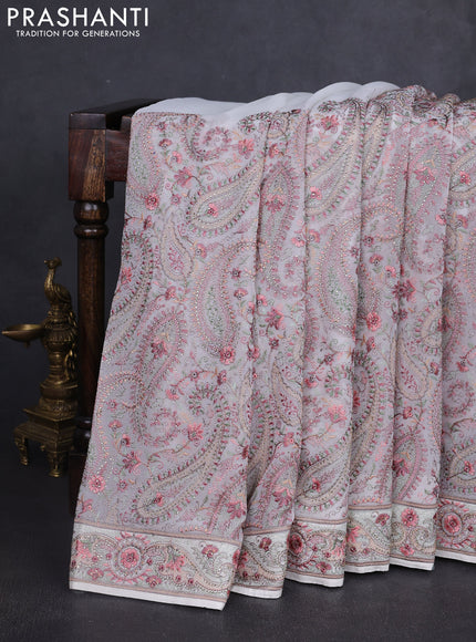 Georgette saree off white with allover paisley embroidery stone work