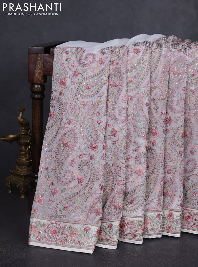 Georgette saree off white with allover paisley embroidery stone work