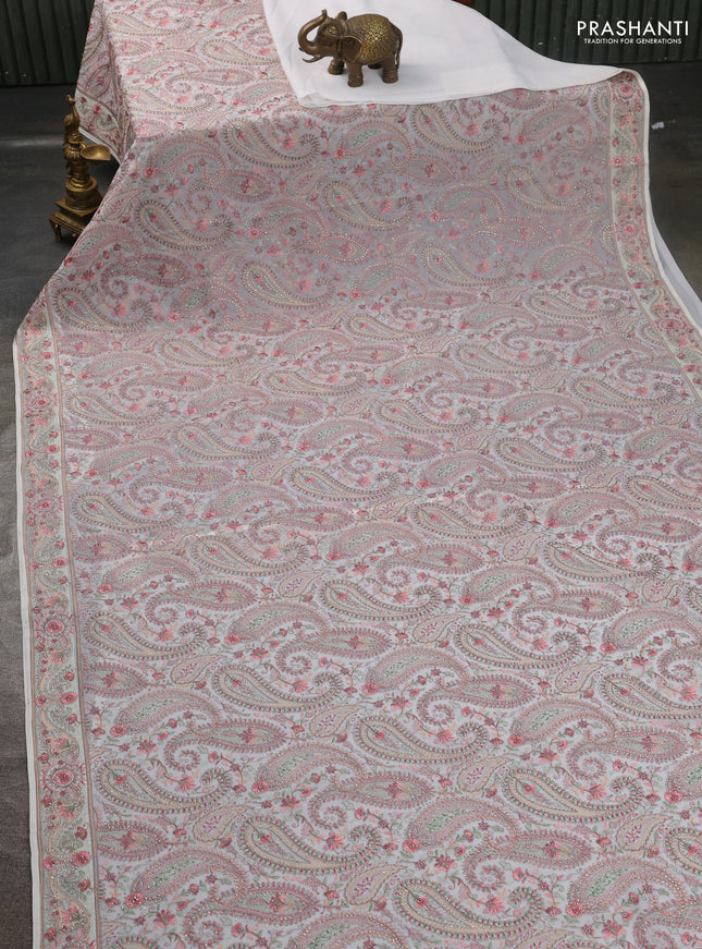 Georgette saree off white with allover paisley embroidery stone work