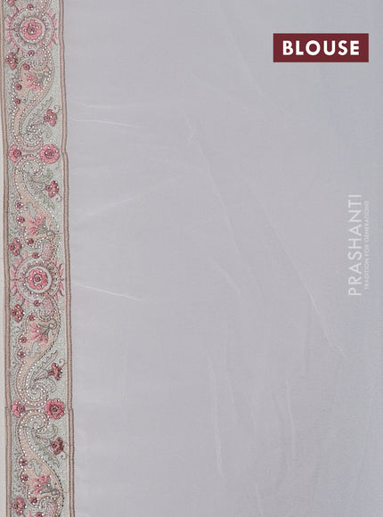 Georgette saree off white with allover paisley embroidery stone work