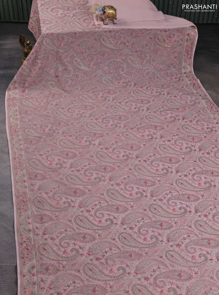 Georgette saree peach shade with allover paisley embroidery stone work
