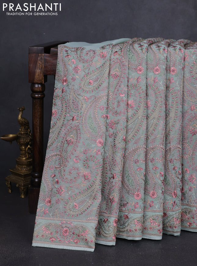 Georgette saree pastel green with allover paisley embroidery stone work