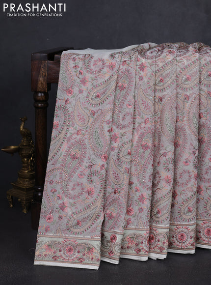 Georgette saree off white with allover paisley embroidery stone work