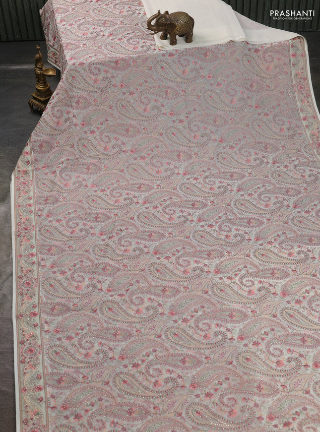 Georgette saree off white with allover paisley embroidery stone work