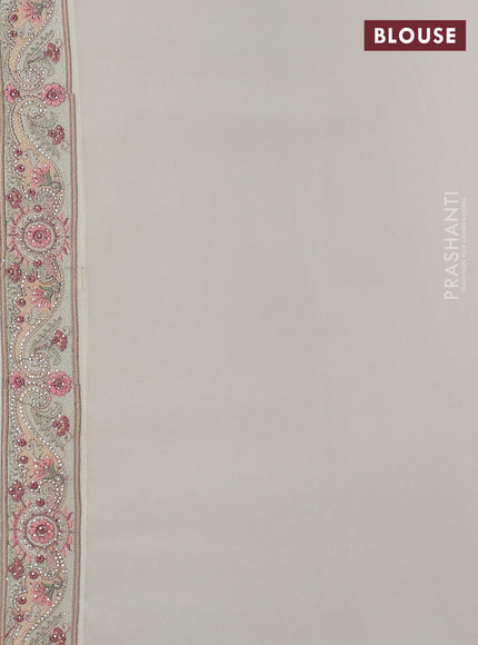 Georgette saree off white with allover paisley embroidery stone work