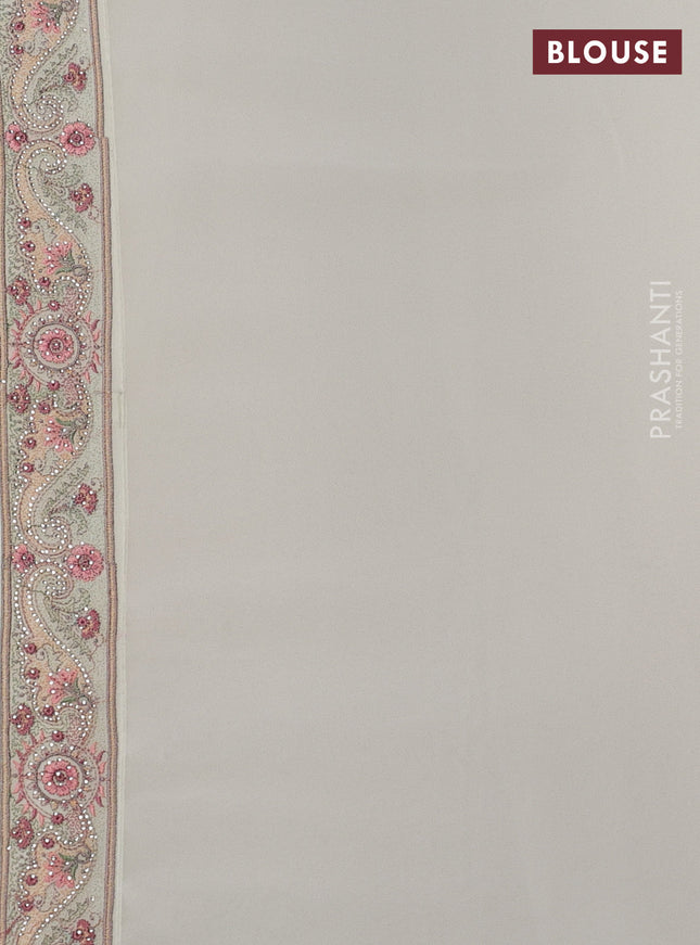 Georgette saree off white with allover paisley embroidery stone work