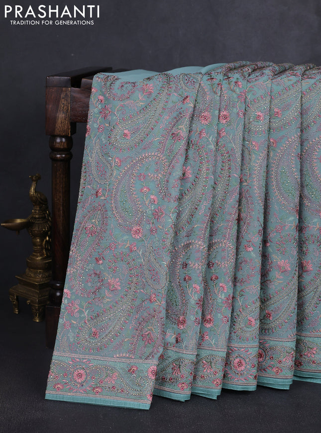 Georgette saree teal green with allover paisley embroidery stone work
