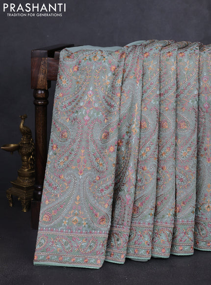 Georgette saree pastel green with allover paisley embroidery stone work
