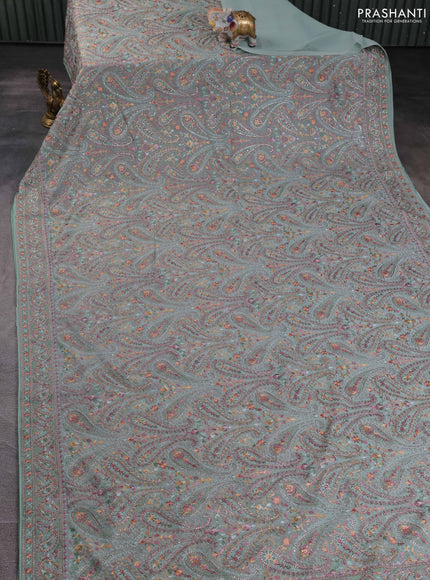 Georgette saree pastel green with allover paisley embroidery stone work