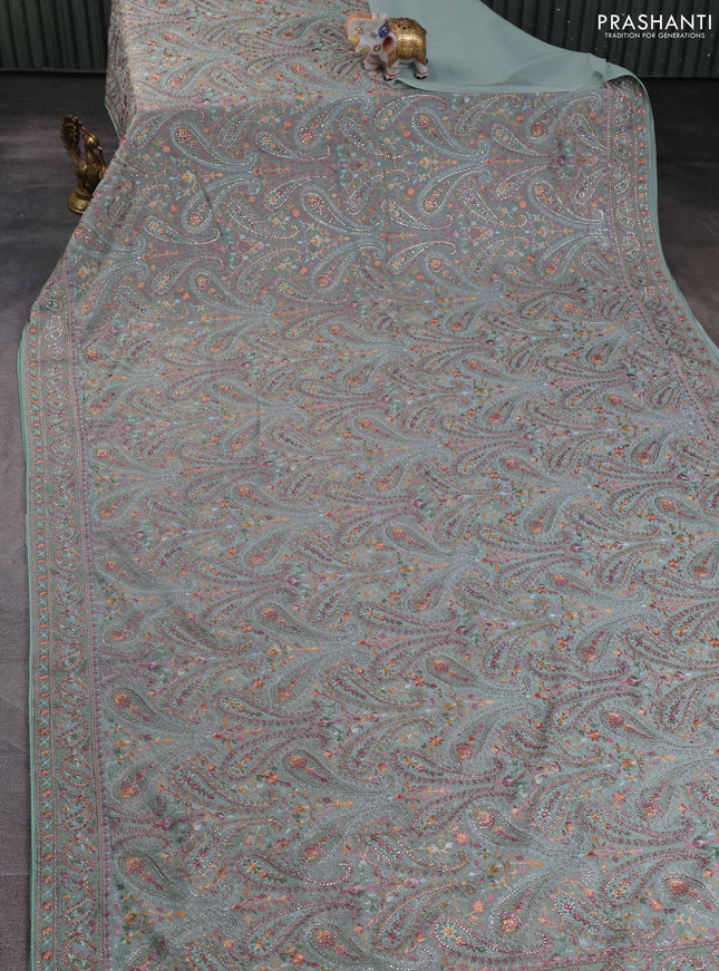 Georgette saree pastel green with allover paisley embroidery stone work