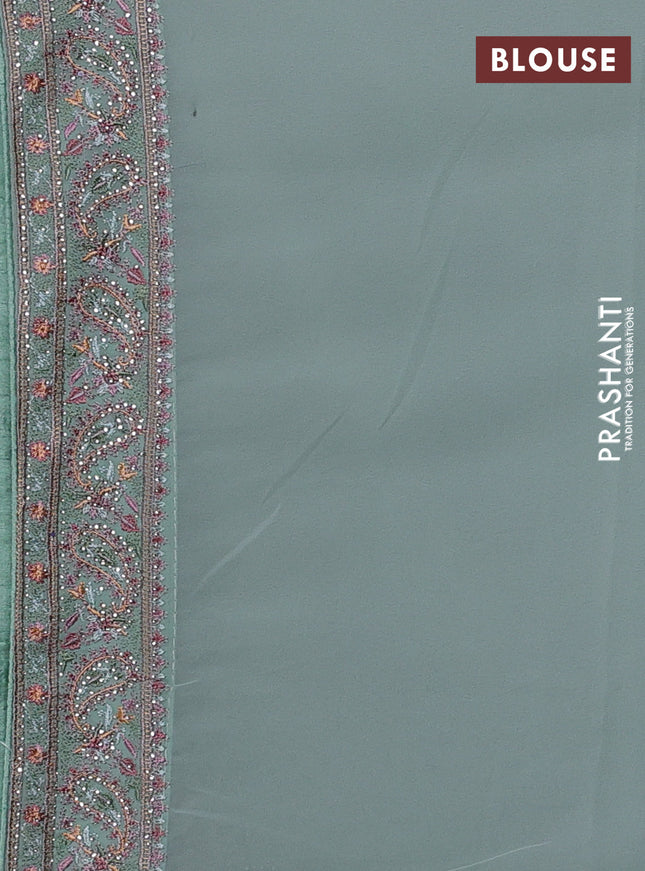 Georgette saree pastel green with allover paisley embroidery stone work