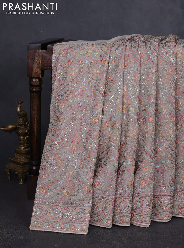 Georgette saree beige with allover paisley embroidery stone work