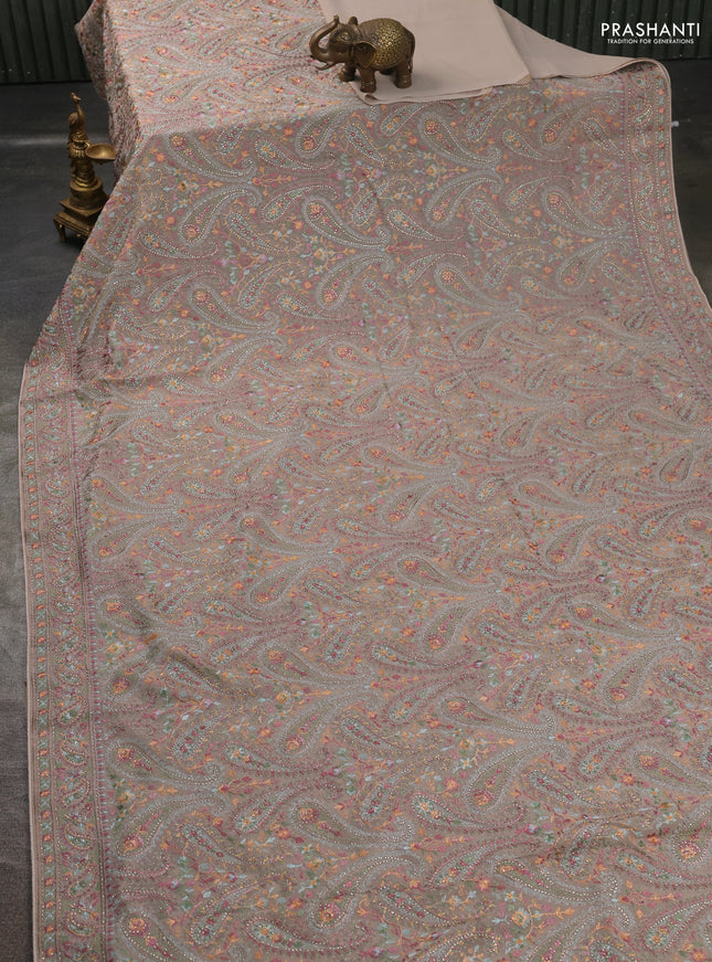 Georgette saree beige with allover paisley embroidery stone work
