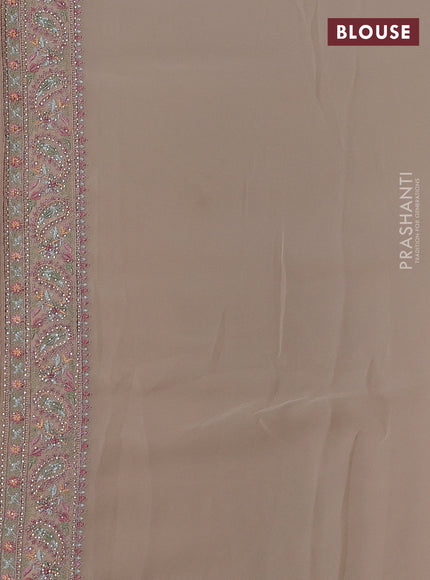 Georgette saree beige with allover paisley embroidery stone work