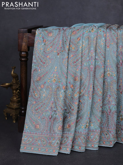 Georgette saree pastel blue with allover paisley embroidery stone work