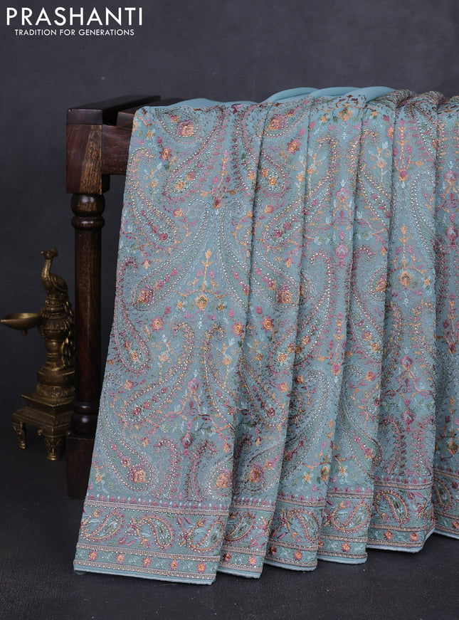 Georgette saree pastel blue with allover paisley embroidery stone work