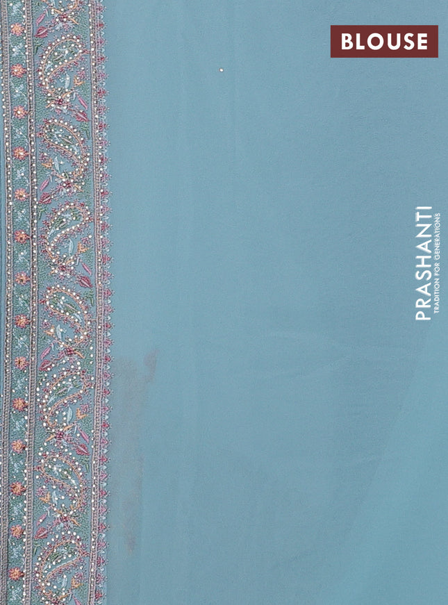 Georgette saree pastel blue with allover paisley embroidery stone work