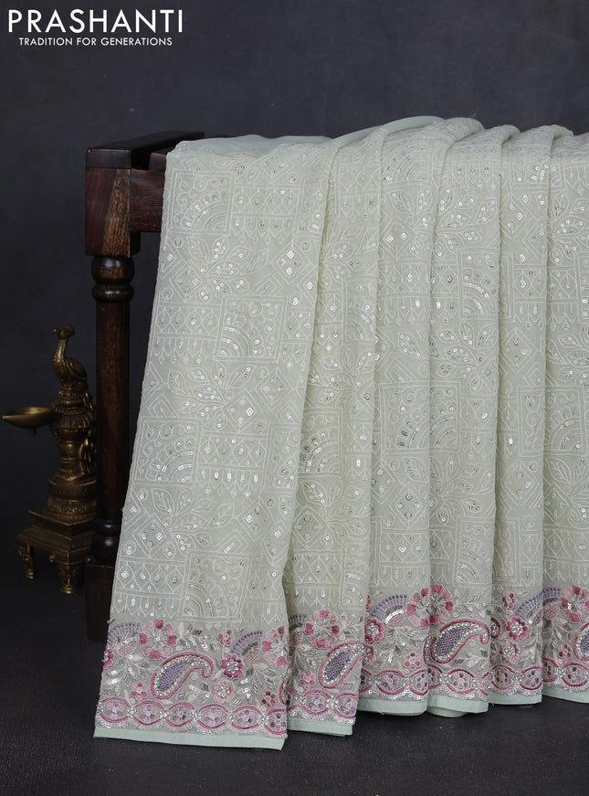 Georgette saree pastel green with allover sequin embroidery work and embroidery stone work border