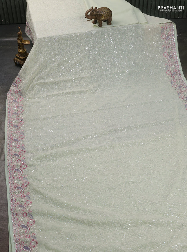 Georgette saree pastel green with allover sequin embroidery work and embroidery stone work border