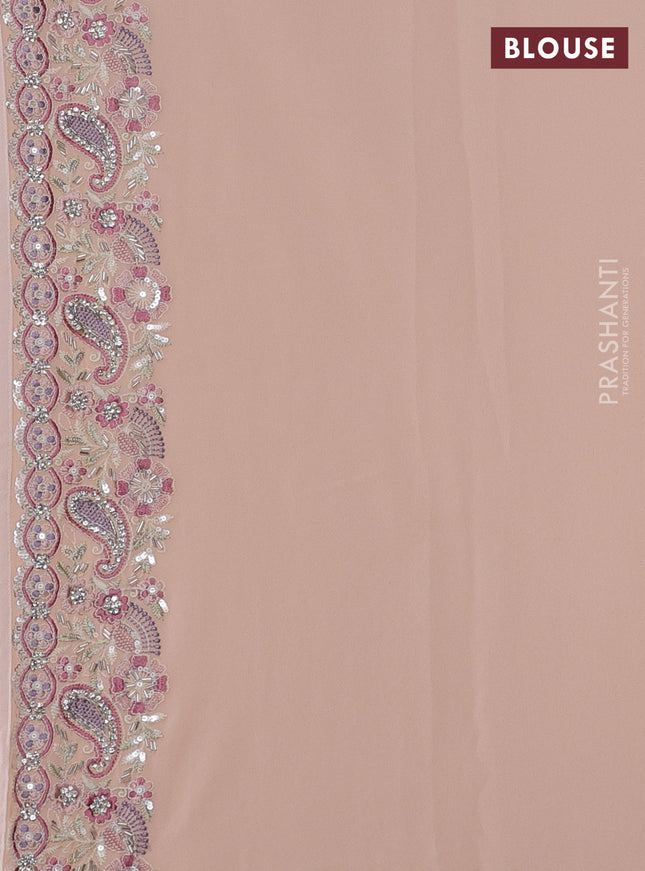Georgette saree mild peach with allover sequin embroidery work and embroidery stone work border