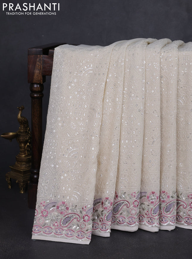 Georgette saree off white with allover sequin embroidery work and embroidery stone work border