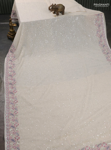 Georgette saree off white with allover sequin embroidery work and embroidery stone work border