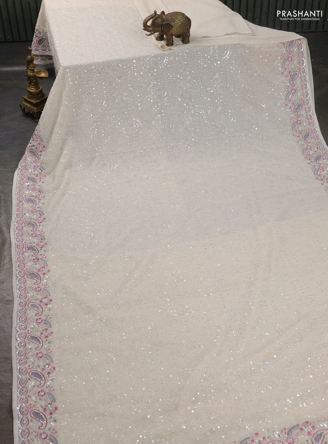 Georgette saree off white with allover sequin embroidery work and embroidery stone work border