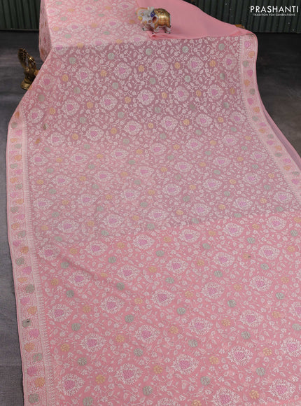Georgette saree peach shade with allover embroidery work
