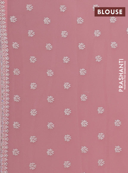Georgette saree peach shade with allover embroidery work