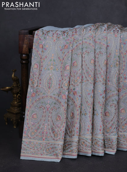 Georgette saree pastel blue with allover paisley embroidery stone work