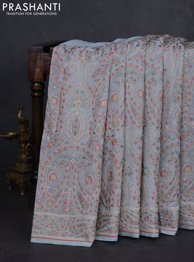 Georgette saree pastel blue with allover paisley embroidery stone work