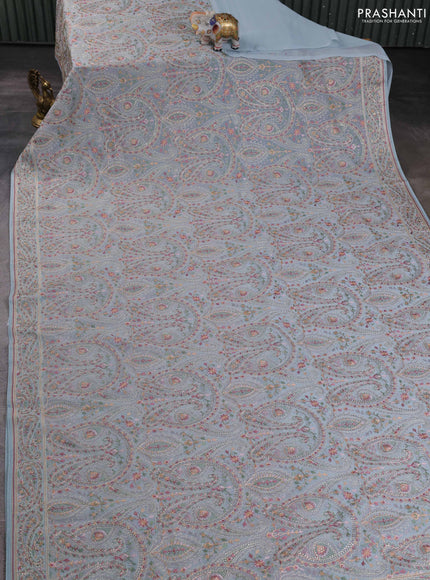 Georgette saree pastel blue with allover paisley embroidery stone work