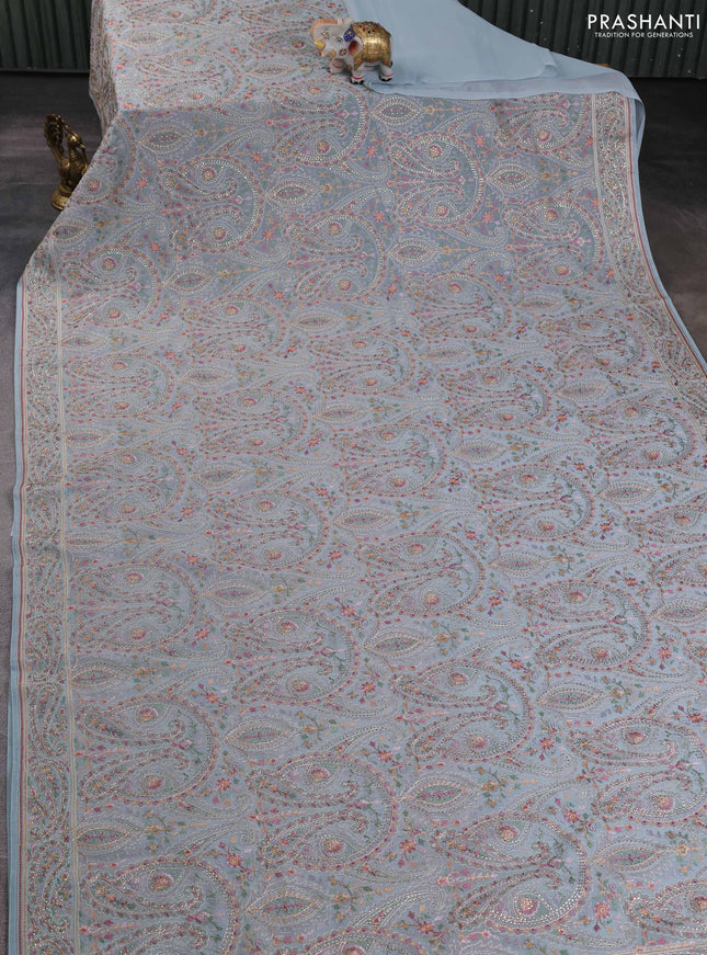 Georgette saree pastel blue with allover paisley embroidery stone work