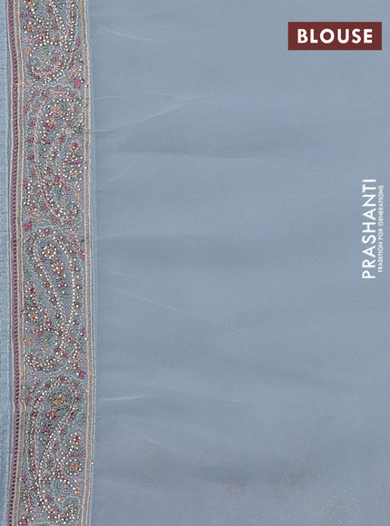 Georgette saree pastel blue with allover paisley embroidery stone work