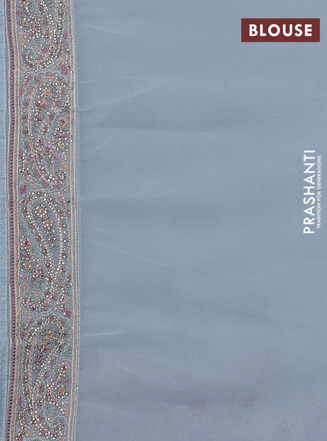 Georgette saree pastel blue with allover paisley embroidery stone work