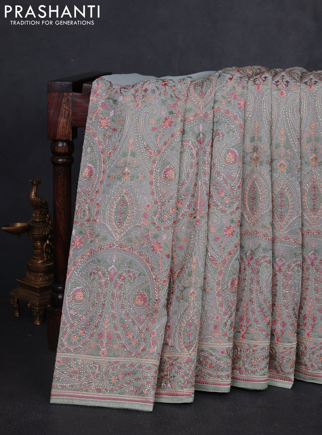 Georgette saree pastel green with allover paisley embroidery stone work