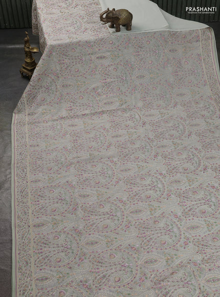Georgette saree pastel green with allover paisley embroidery stone work