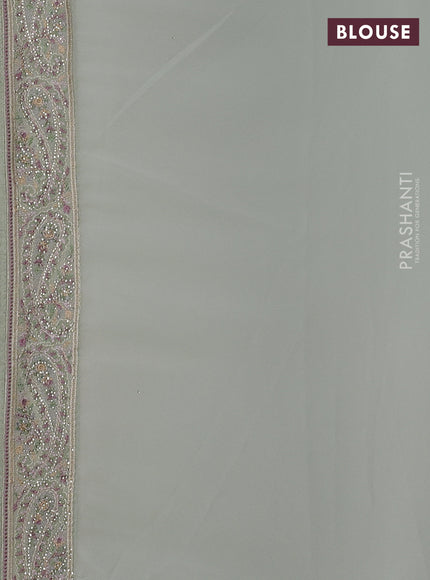 Georgette saree pastel green with allover paisley embroidery stone work