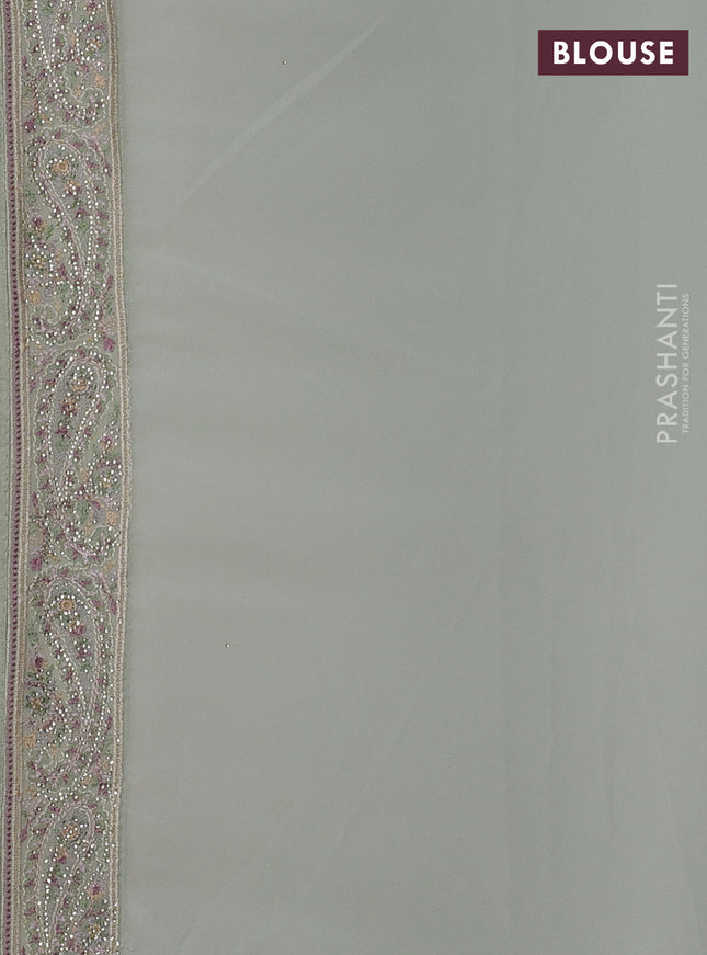 Georgette saree pastel green with allover paisley embroidery stone work