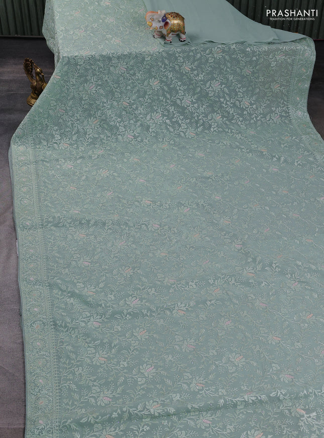Georgette saree pastel green with allover embroidery work and embroidery border