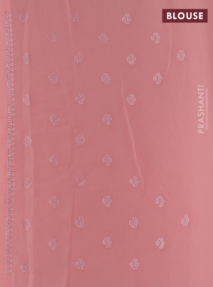 Georgette saree peach shade with allover embroidery work and embroidery border